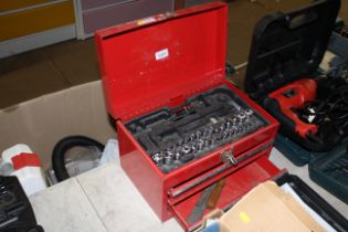 A small red metal tool chest and contents of part