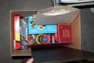 A box of vintage toys and games together with a folder of vintage knitting patterns and embroidery