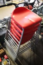 Six plastic and metal framed stacking stools