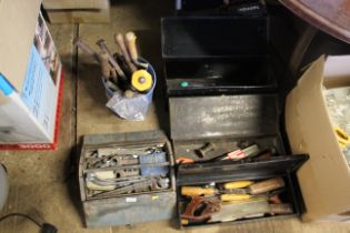 Four metal tool boxes and contents of various tool