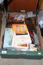 A box containing wood plaques, Spong mincer, tins,