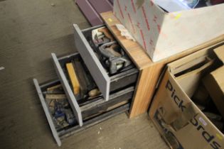 A wooden two drawer chest and contents of various