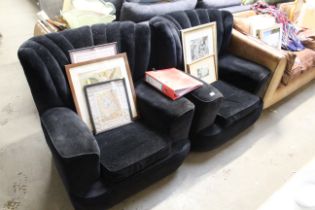 A pair of black upholstered Art Deco style armchairs