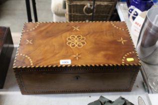 A wooden inlaid writing box