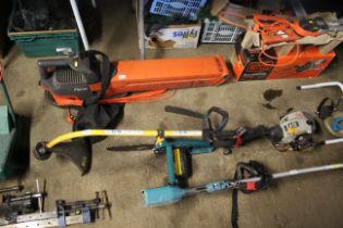 A Ryobi PLT petrol strimmer and a Black & Decker D