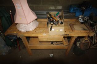 A wooden Clarke Woodworker work bench with fitted