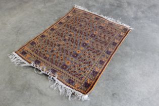 An approx. 4'4" x 3'2" patterned rug