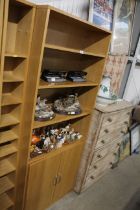 A modern bookcase fitted cupboard below