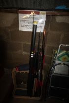 A quantity of various fishing rods and travel case