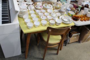 A retro Formica topped table and two kitchen chair