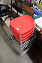 Four plastic and metal stacking stools