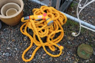A length of expanding garden hose together with a