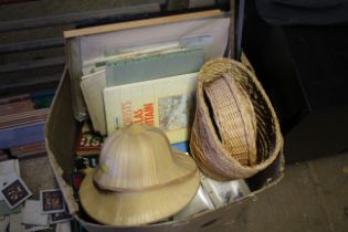 A box containing two wicker hats, three wicker bas