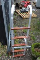 A hanging five rail ladder by Bembridge and Jenkin