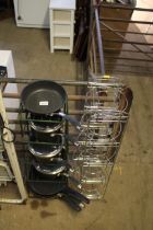 A chrome effect five tier saucepan stand, a wire s