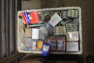 A box containing various fixings, nails, screws et