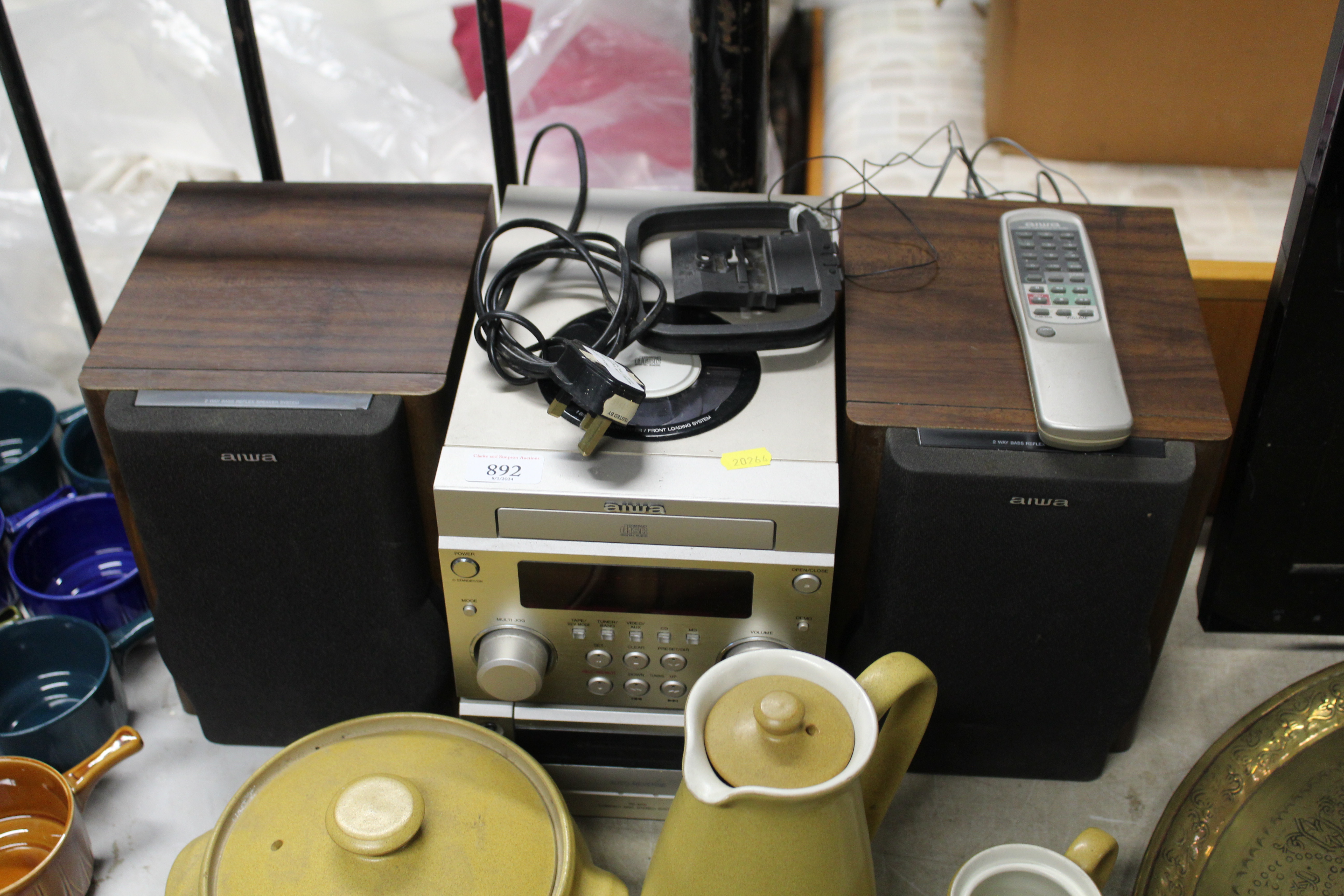 An Aiwa Hi-Fi with a pair of speakers and remote control