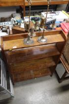 An oak graduated open fronted bookcase