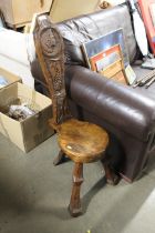 A carved wooden spinning chair