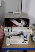 A New Home electric sewing machine and accessories