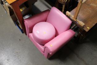 A child's pink upholsters chair and stool