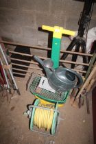 A length of garden hose and hose reel, a plastic w