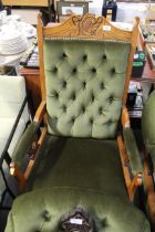An Edwardian button down upholstered arm chair