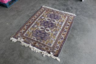 An approx. 3'8" x 4'9" patterned rug