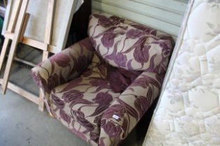 A floral upholstered deep seated armchair
