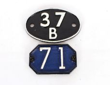 An oval cast iron marker sign "37B"; and a cast ir