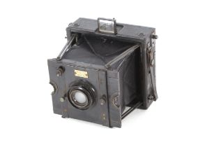 A bellows camera by Ross of London with carrying c