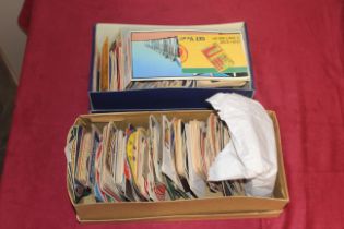 A collection of various collectable beer mats contained in two shoe boxes