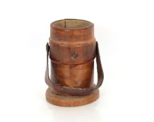 An antique leather clad shot or powder bucket, 25cm