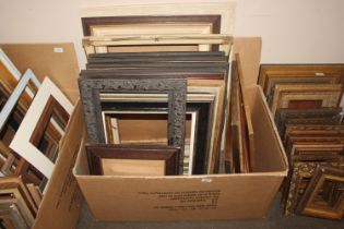 A box containing miscellaneous picture frames