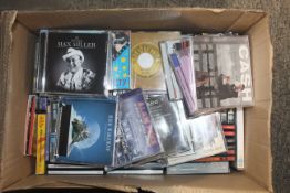 A collection of miscellaneous CD's and DVD's