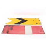 A yellow and white enamel chevron signal and a red