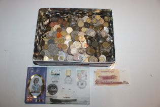 A tin containing various coinage and bank notes