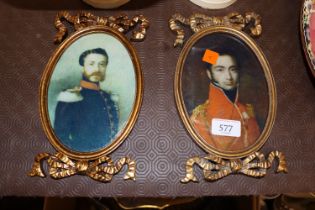 A pair of gilt framed miniature prints