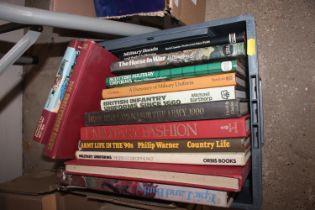 A box of various military uniform books