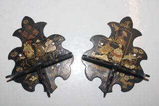 A pair of black lacquered and decorated folding wa