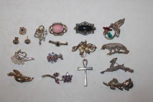 A box of costume brooches