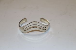 A hallmark sterling silver cuff bangle, approx. 25