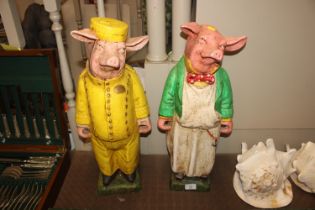 A pair of glazed butcher's shop pig advertising fi