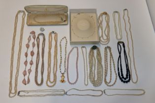 A collection of simulated pearl and bead necklaces