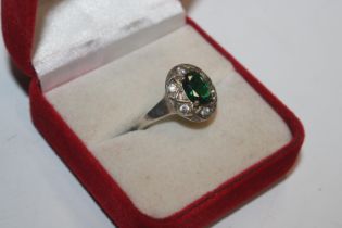 A 925 silver ring set with emerald coloured stone