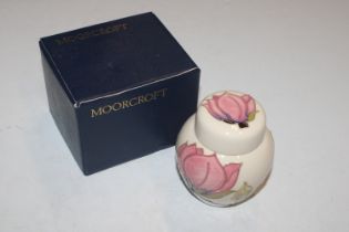 A Moorcroft pottery ginger jar and cover with orig