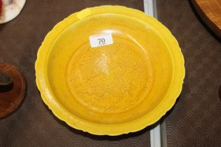 A Chinese yellow ground shallow bowl with decorati