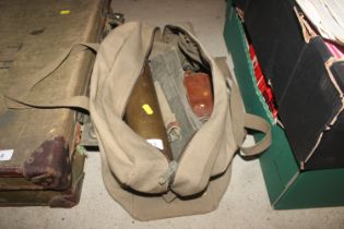 A US kit bag and contents to include a brass shell