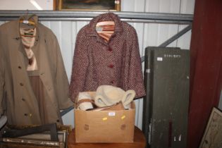 A ladies Aquascutum coat and a box of sheepskin ha