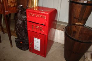 A reproduction red post box